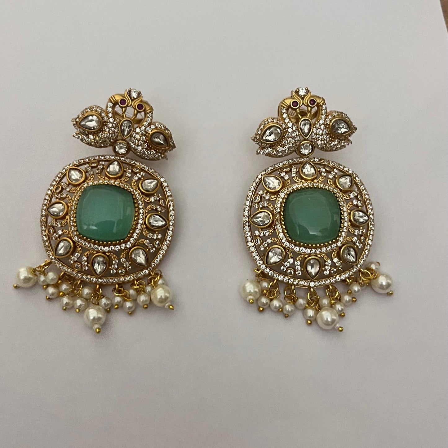 Haripriya Alankaar Set | Kundan Brass Choker with Green Stones & Earrings