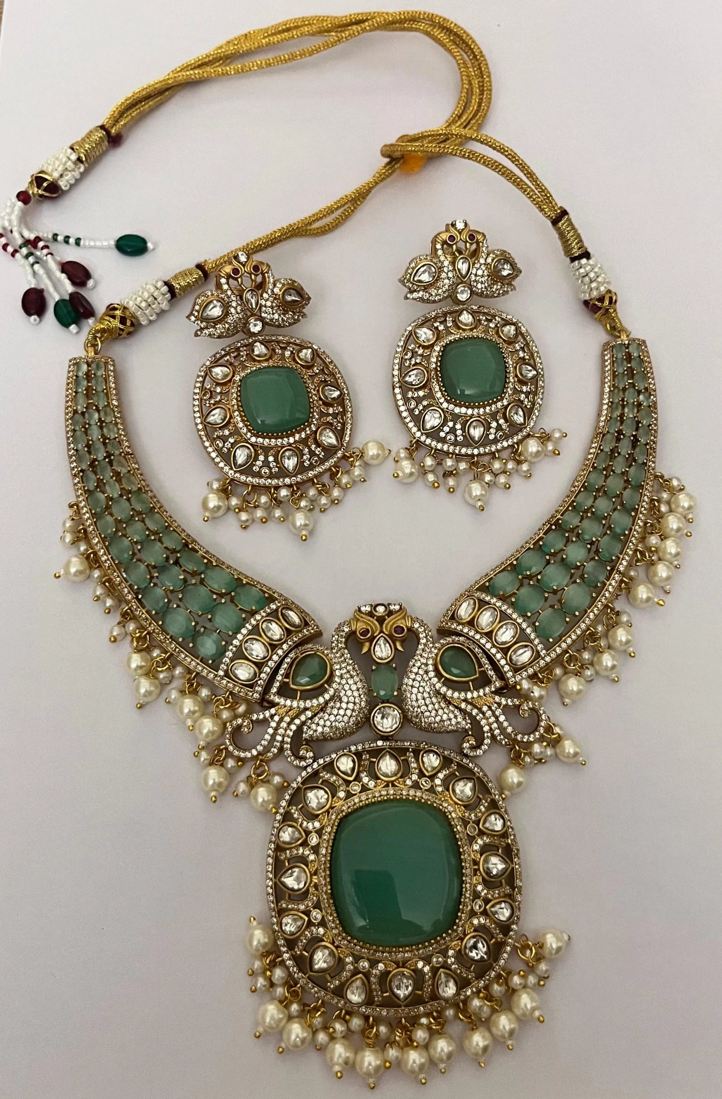 Haripriya Alankaar Set | Kundan Brass Choker with Green Stones & Earrings