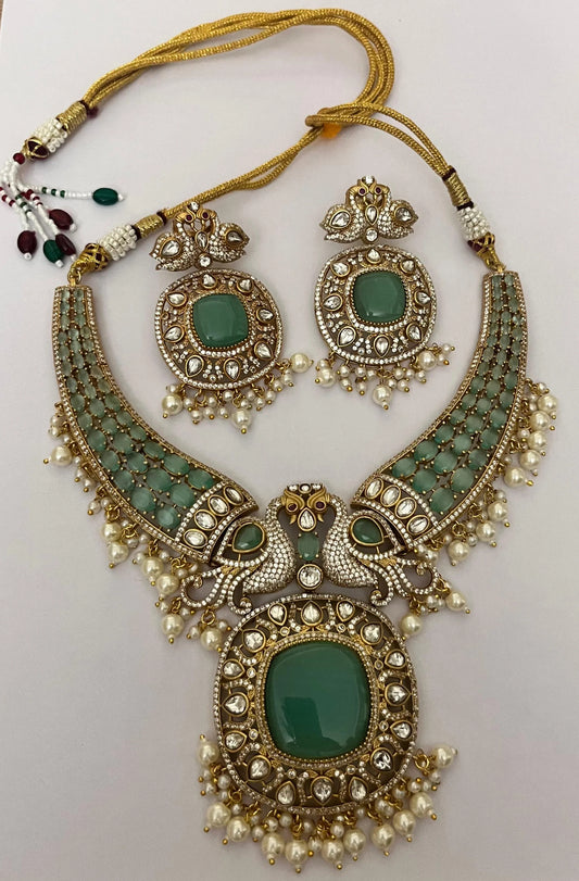 Haripriya Alankaar Set | Kundan Brass Choker with Green Stones & Earrings